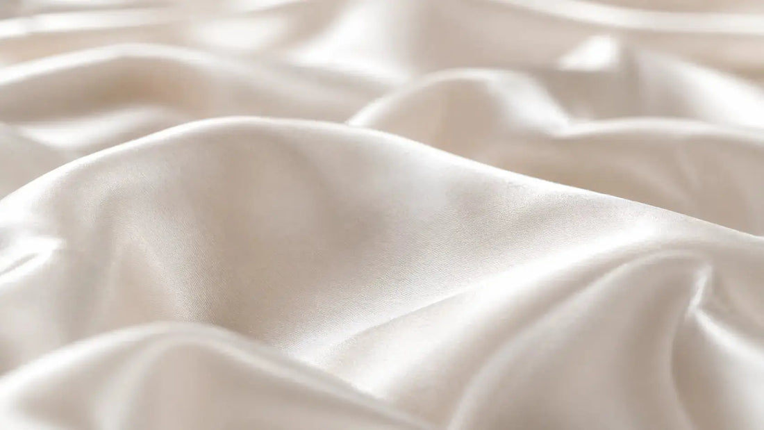 Close-up of silk fabric weave showing thread density - complete reference guide to momme count in silk and what it means for quality and durability