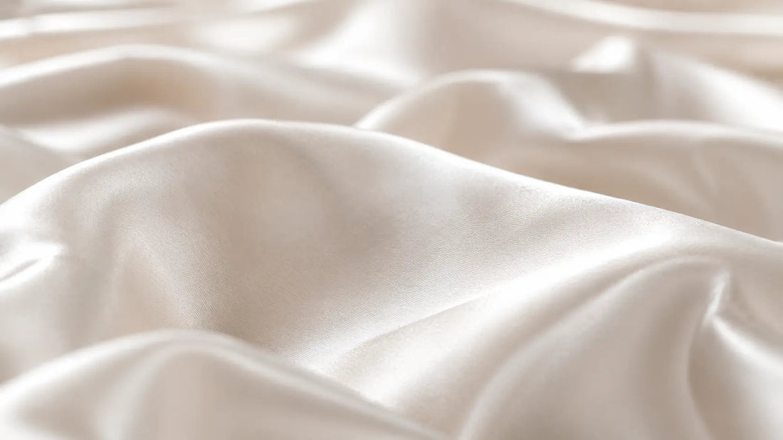 Close-up of silk fabric weave showing thread density - complete reference guide to momme count in silk and what it means for quality and durability
